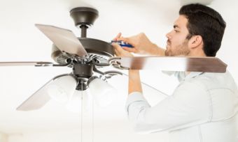 man installing ceiling fans